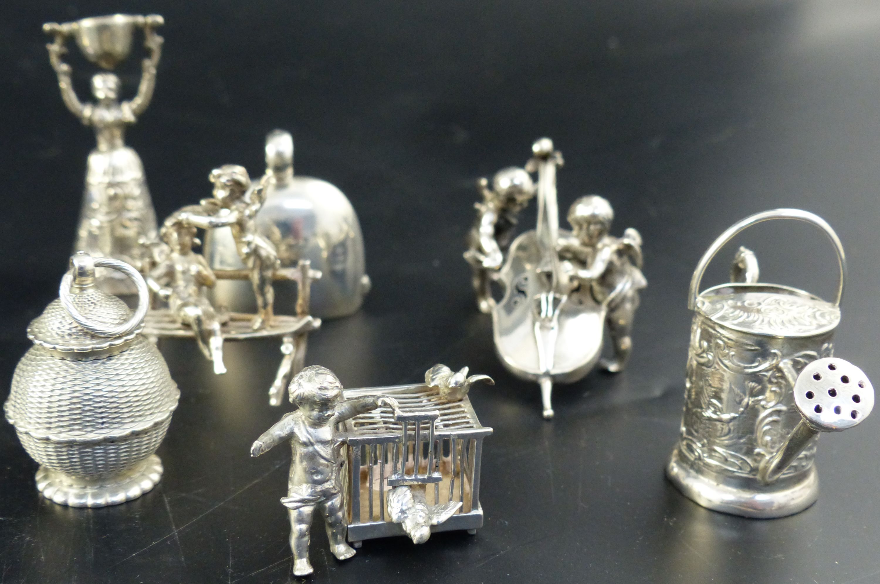 A group of twenty two silver and plated miniatures,